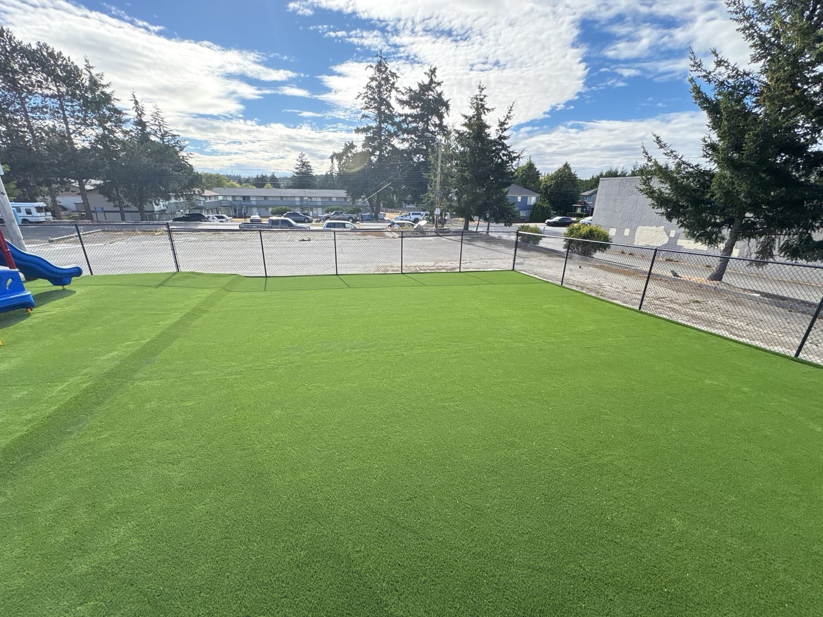 Large turf play field with room to run at the Midway Blvd location