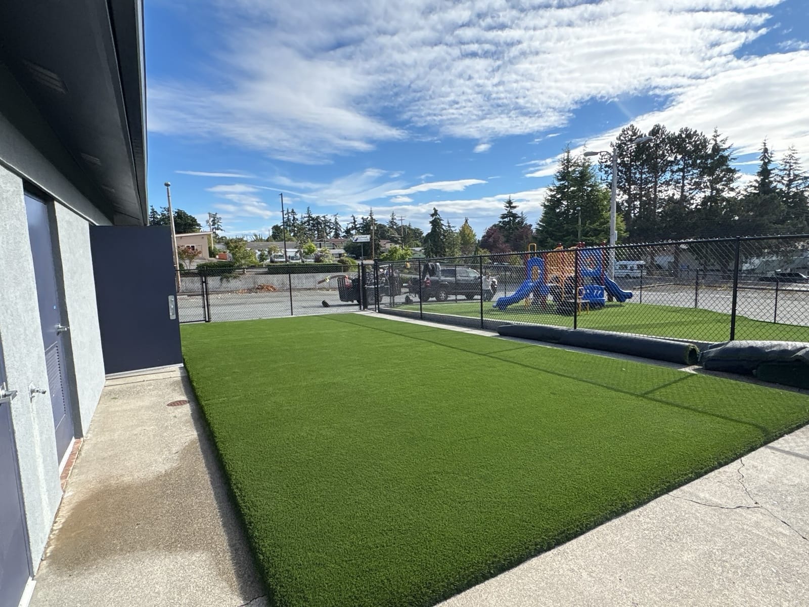 Side turf yard alongside the Midway Blvd building